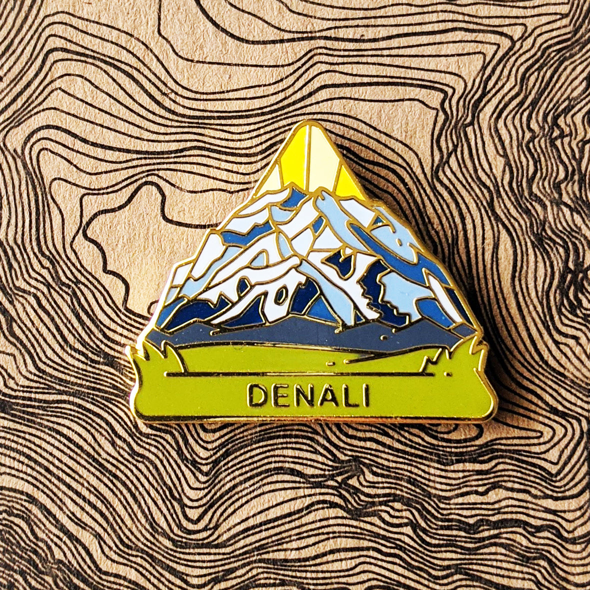  Triangle Denali national park enamel pin featuring a view of Denali mountain.