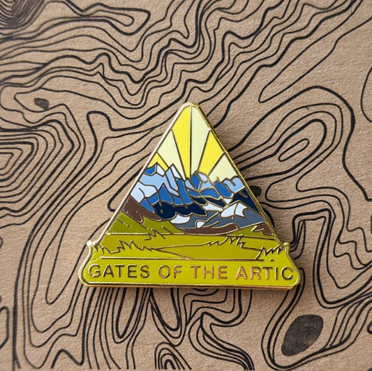 Triangle Gates of the Arctic national park enamel pin featuring a view of Arrigetch Peaks.