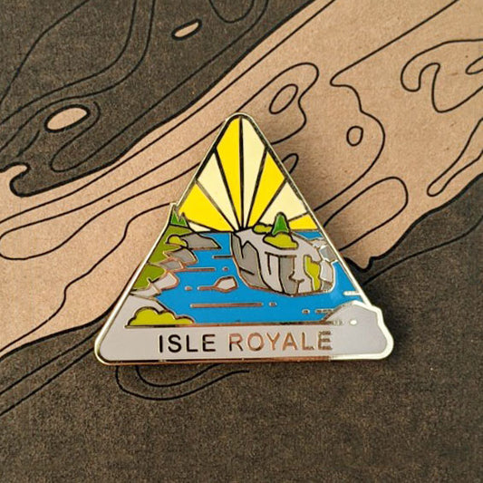 Triangle Isle Royale national park enamel pin featuring a view of Scoville Point.