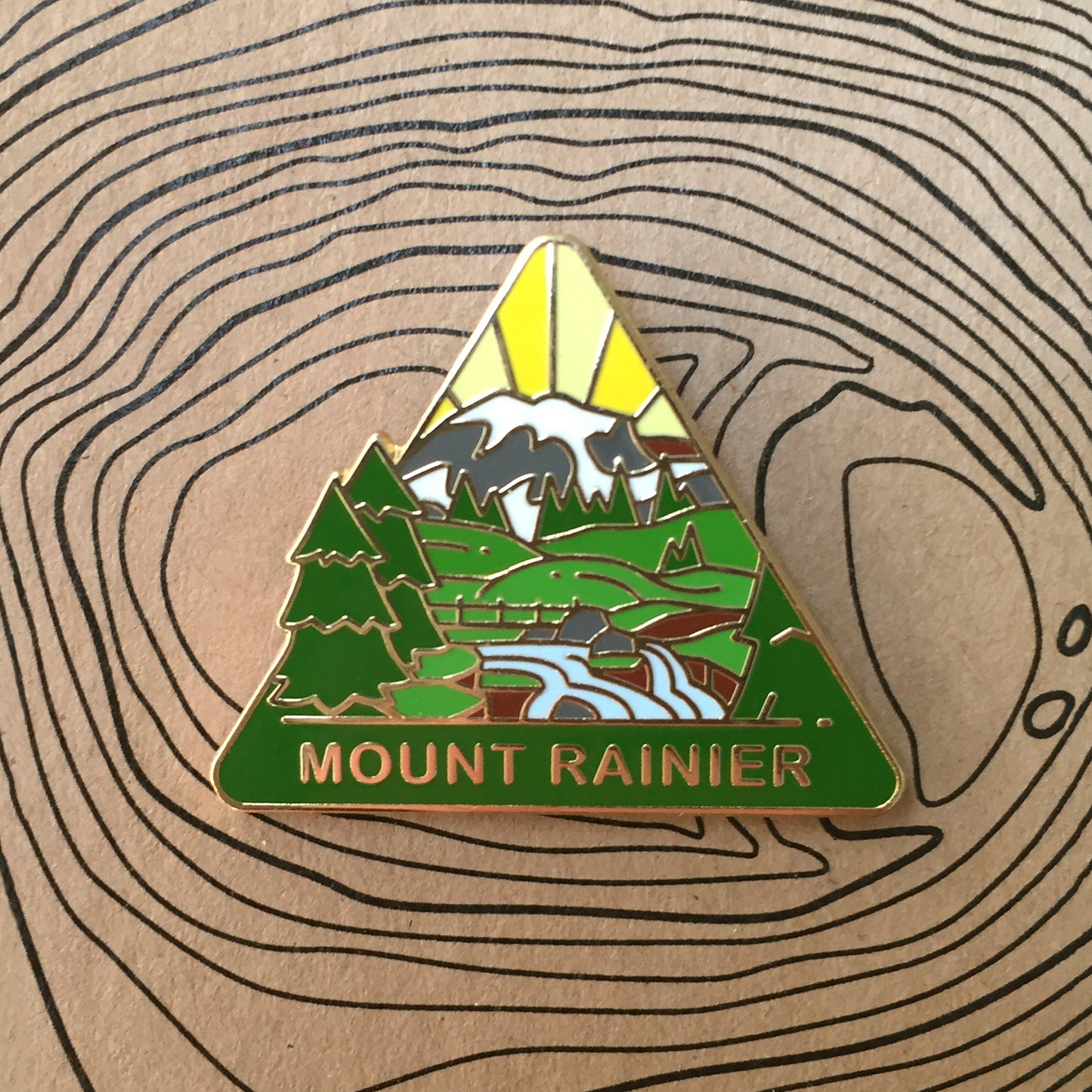 Triangle Mount Rainier national park enamel pin featuring a view of Myrtle Falls with Mount Rainier in the background.