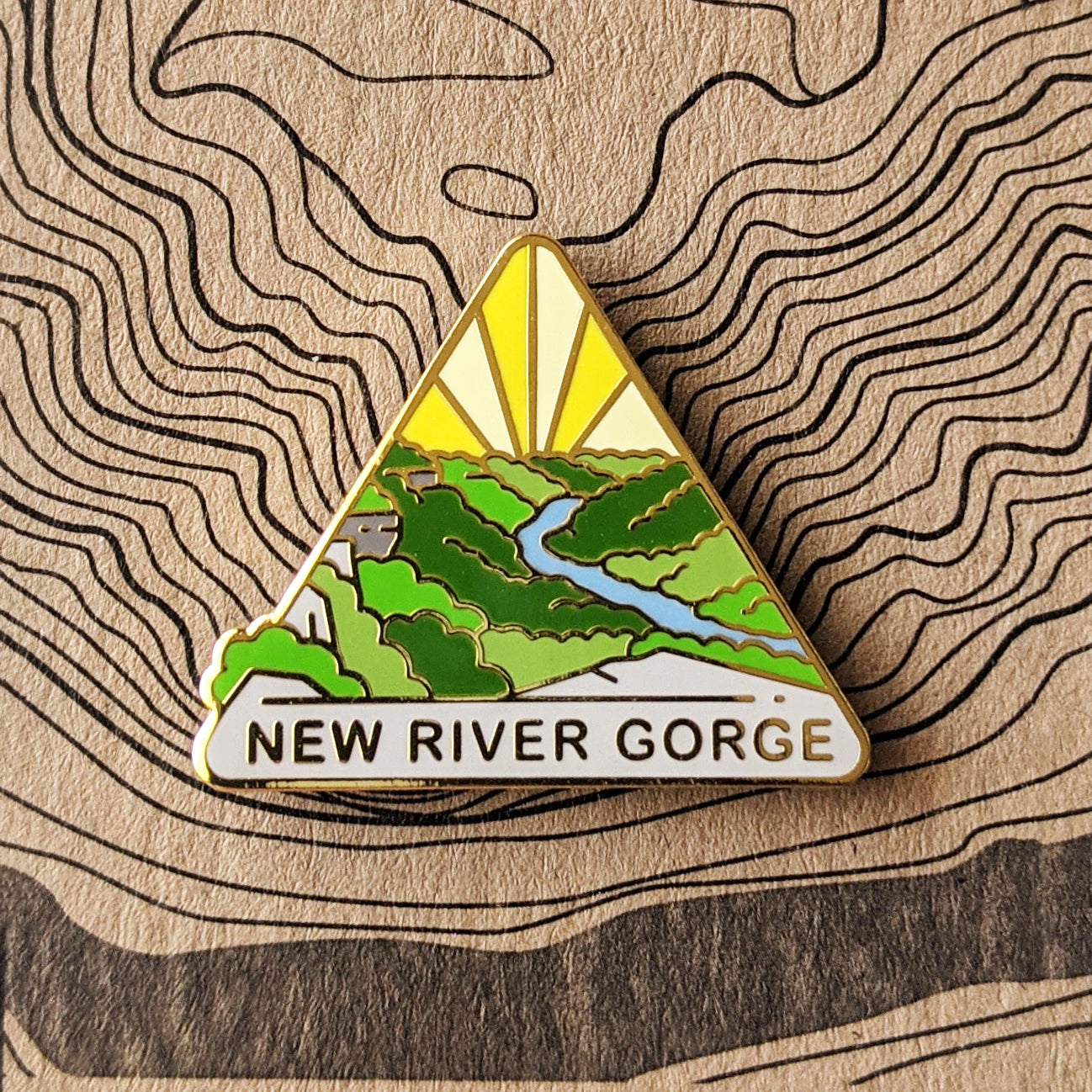 Triangle New River Gorge national park enamel pin featuring a view of Endless Wall.